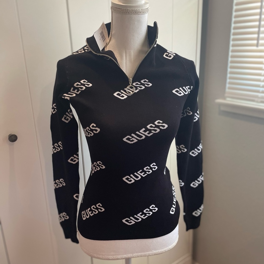 Brand new black and white Guess sweater. Has zipper at the neck